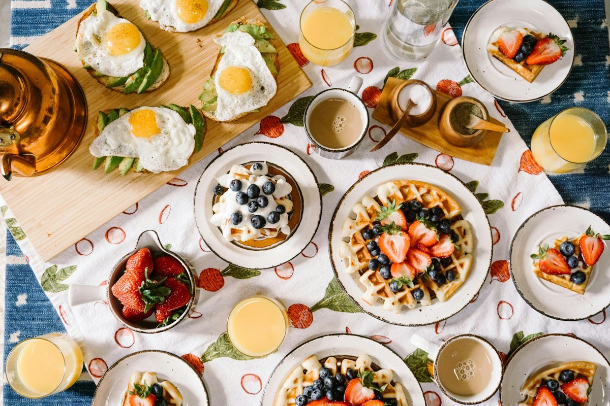 Golden fluffy banana pancakes stacked on a plate